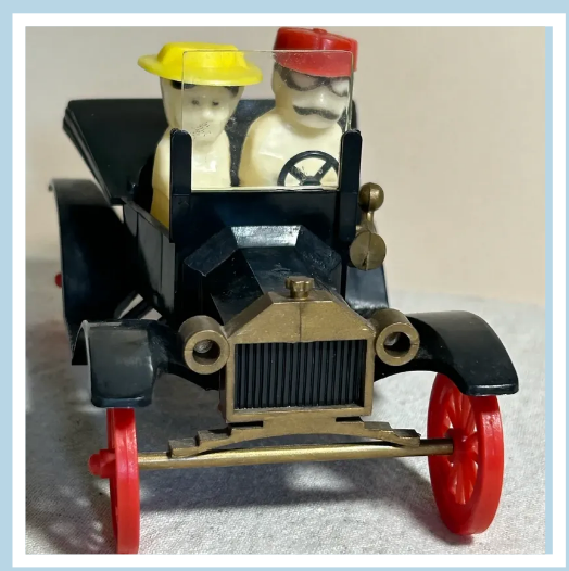 Vintage toy car and collectibles at an estate sale